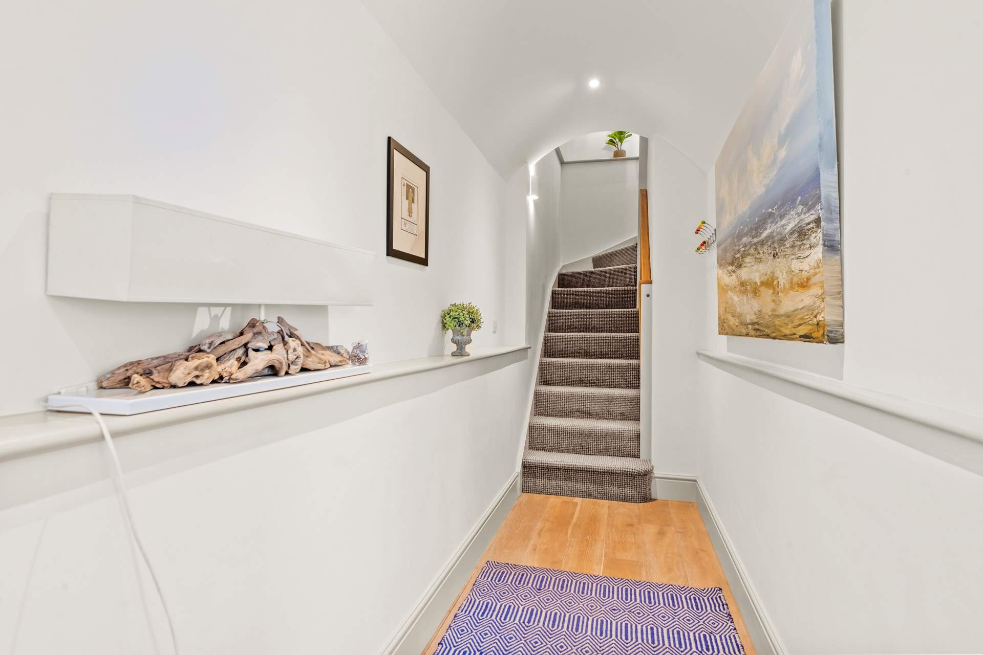 Bedroom 1 is accessed from the hallway. The stairs lead to the first floor open plan living, kitchen and dining-areas.