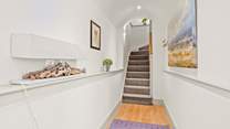 Bedroom 1 is accessed from the hallway. The stairs lead to the first floor open plan living, kitchen and dining-areas.