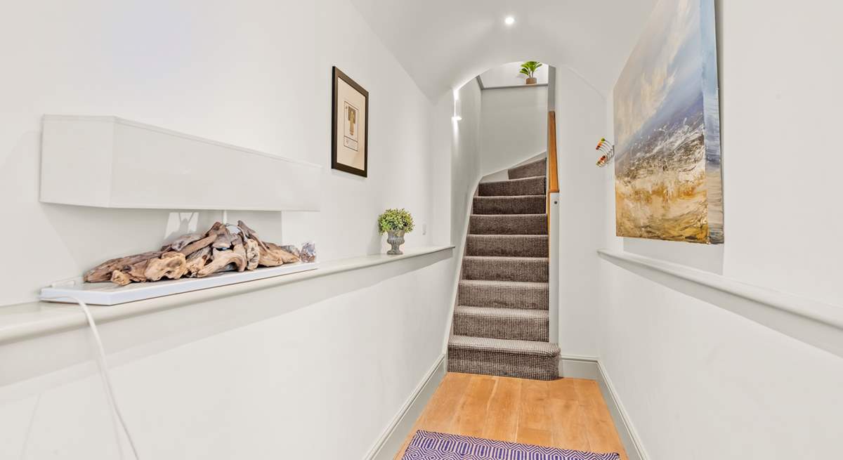 Bedroom 1 is accessed from the hallway. The stairs lead to the first floor open plan living, kitchen and dining-areas.