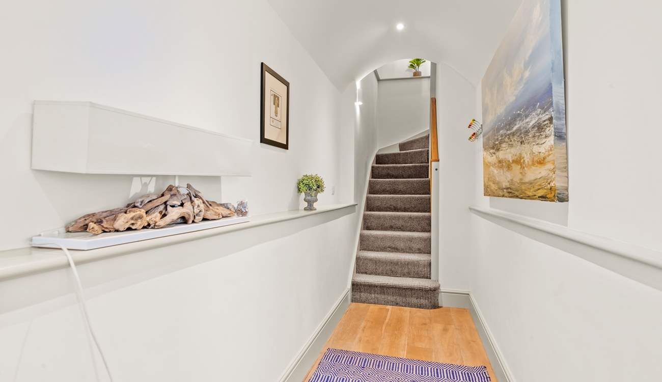 Bedroom 1 is accessed from the hallway. The stairs lead to the first floor open plan living, kitchen and dining-areas.