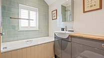 Bedroom 3 is treated to an en suite bathroom.