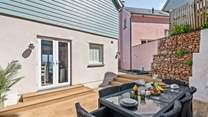 What a lovely spot for a  touch of dining alfresco.