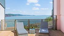 Relaxing with a glass of something bubbly with the glorious English Riviera behind you. Perfect!