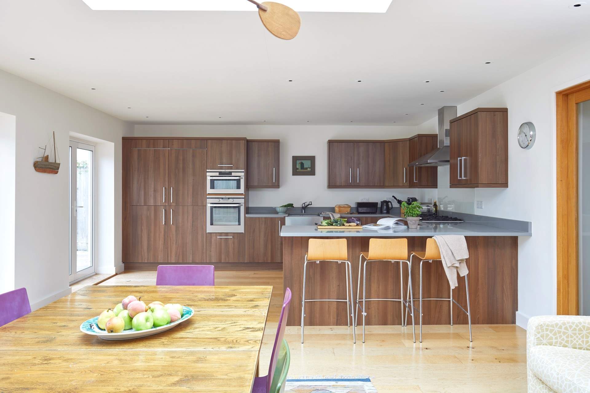 Chat with the chef at the breakfast-bar, or sit at the dining-table with a cuppa while watching the little ones play in the garden.