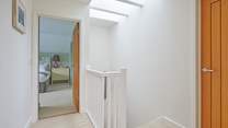 The first floor landing is light and airy thanks to the skylight.