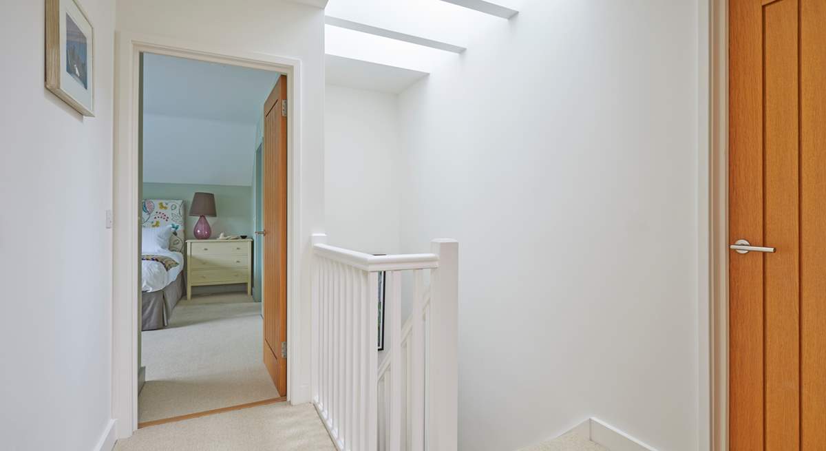 The first floor landing is light and airy thanks to the skylight.
