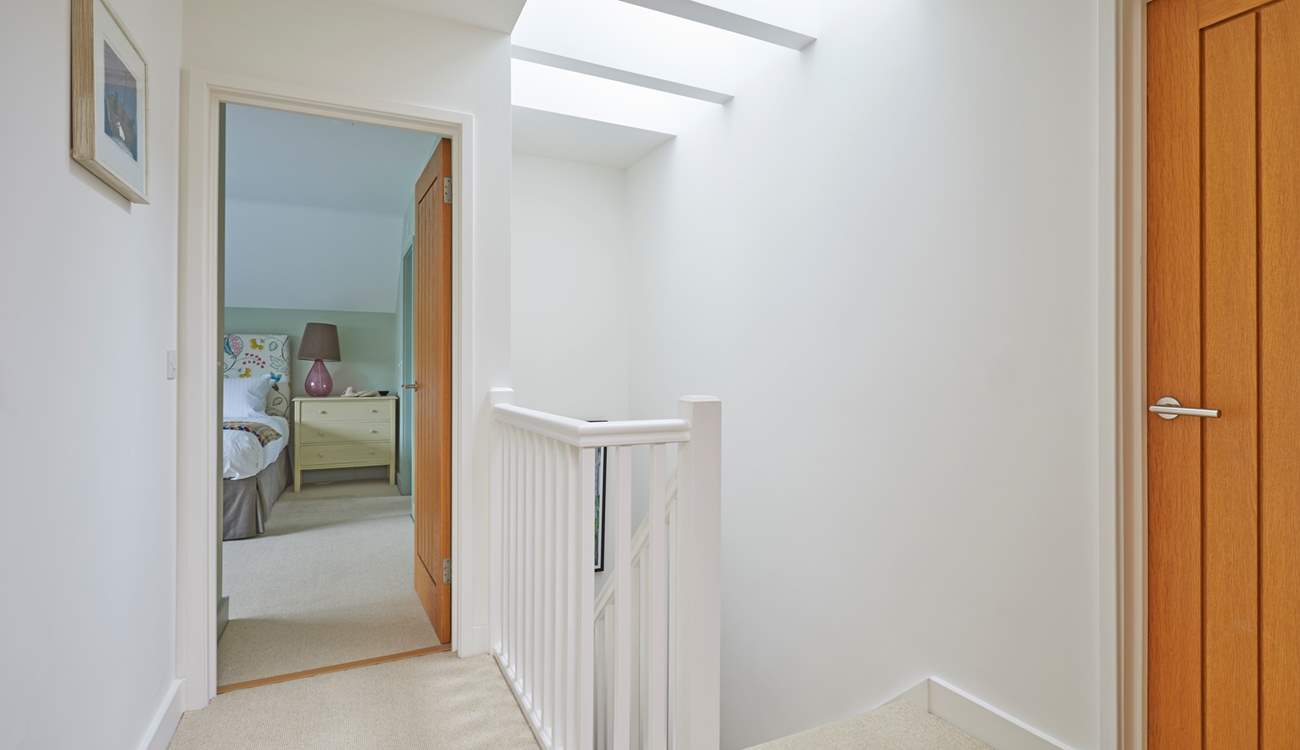 The first floor landing is light and airy thanks to the skylight.