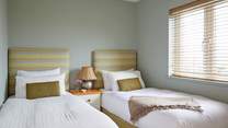 Bedroom 1 with comfortable twin beds, perfect for children or adults...