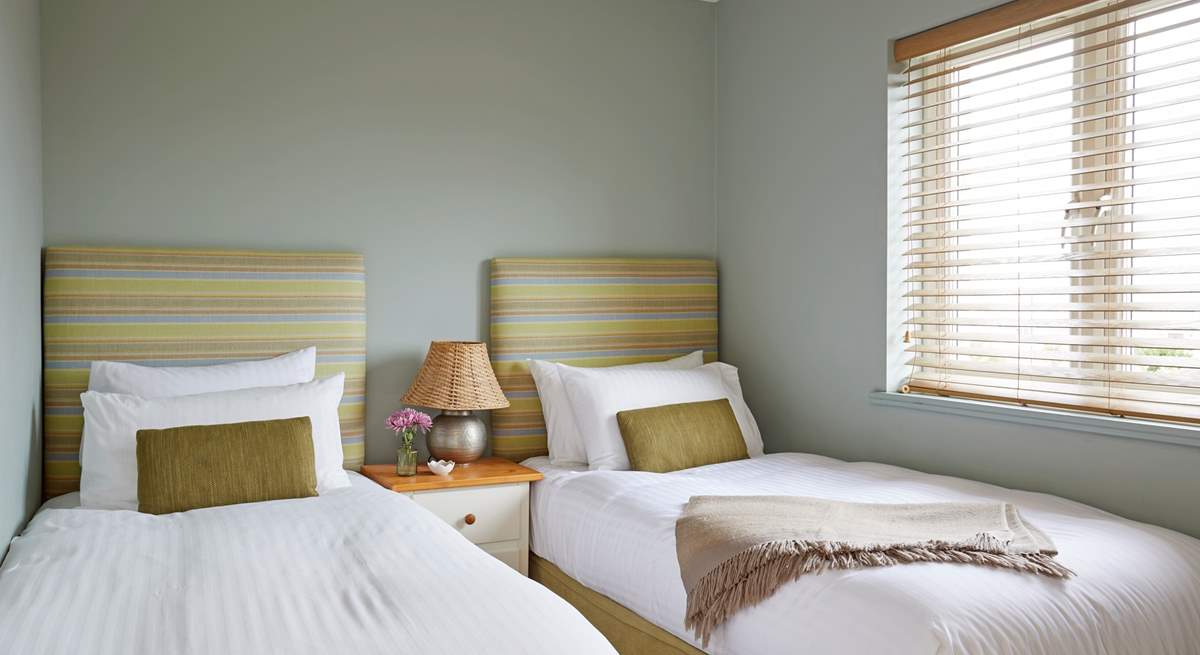 Bedroom 1 with comfortable twin beds, perfect for children or adults...