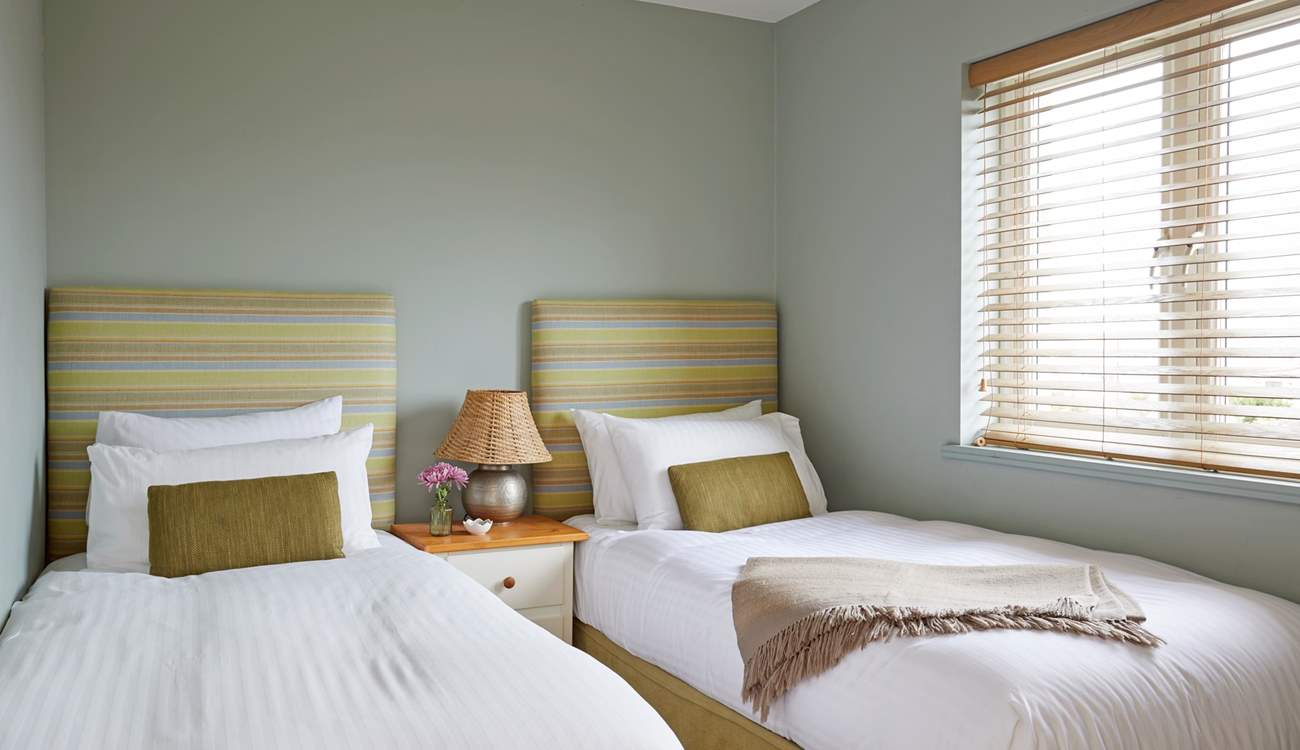 Bedroom 1 with comfortable twin beds, perfect for children or adults...