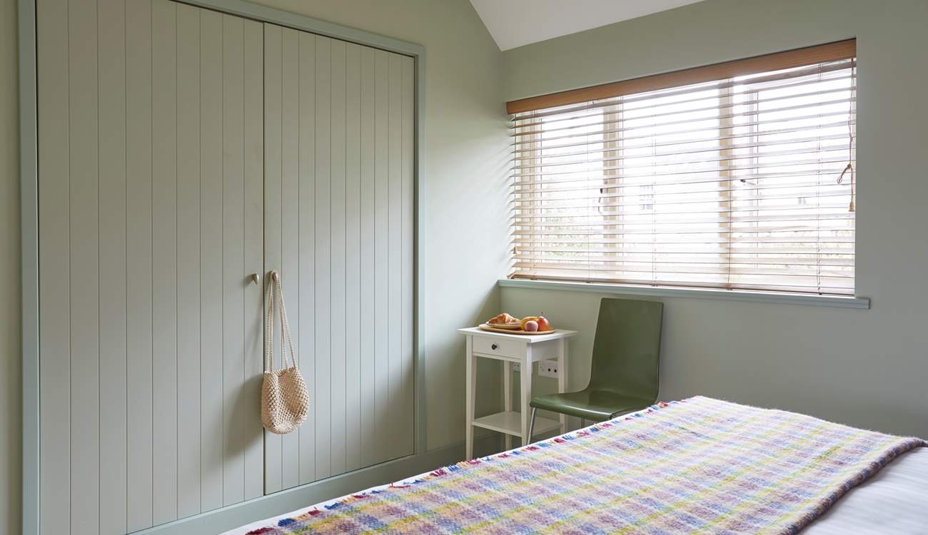 This stylish and generously sized bedroom overlooks the garden and has plenty of storage for all your clobber.