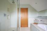 ...with separate shower. Please be aware of the sloping ceilings.
