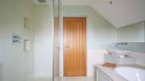 ...with separate shower. Please be aware of the sloping ceilings.