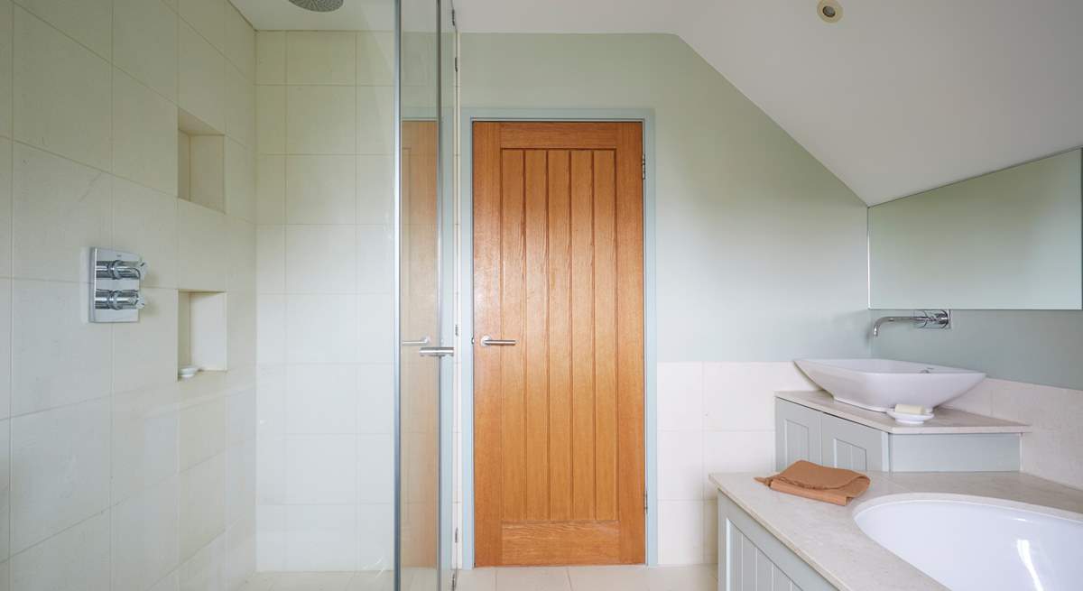 ...with separate shower. Please be aware of the sloping ceilings.