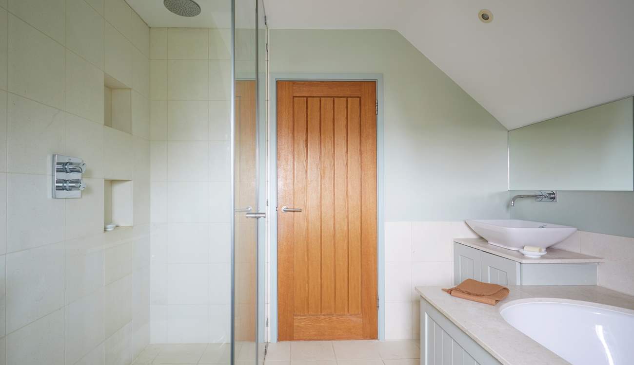 ...with separate shower. Please be aware of the sloping ceilings.