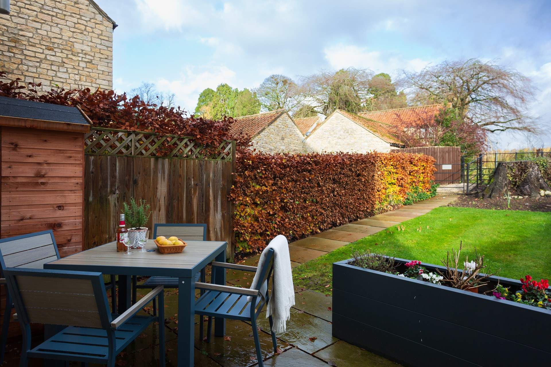 Enjoy a tipple in the pretty garden.