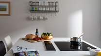 The induction hob sits neatly within the large island. 