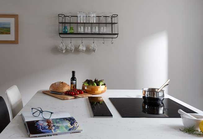 The induction hob sits neatly within the large island. 