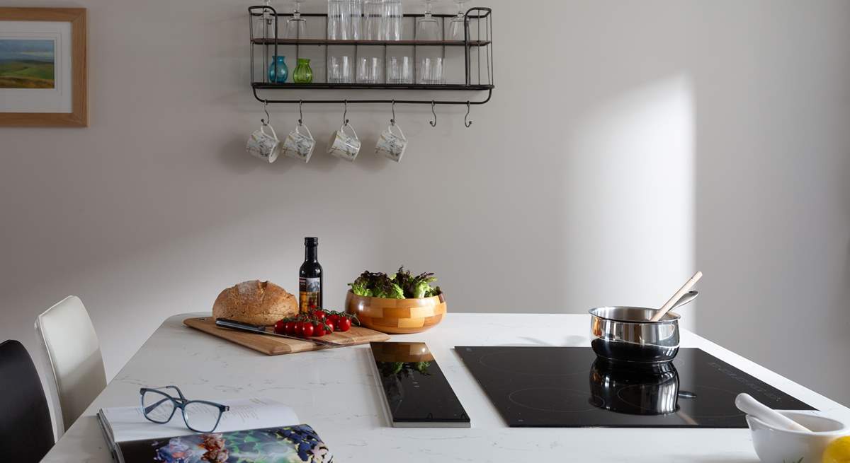 The induction hob sits neatly within the large island. 