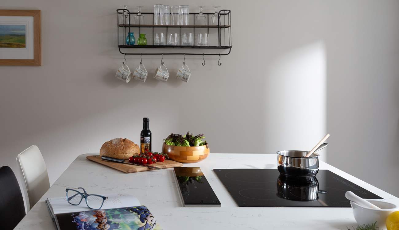 The induction hob sits neatly within the large island. 