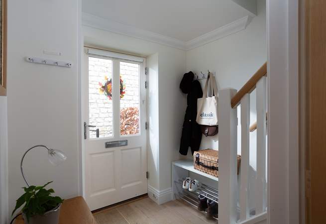Boots and coats have a home in the entrance hall. 