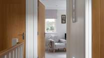 The hallway leads to the snug.
