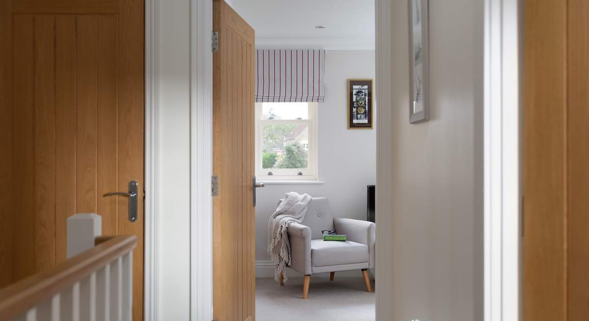 The hallway leads to the snug.