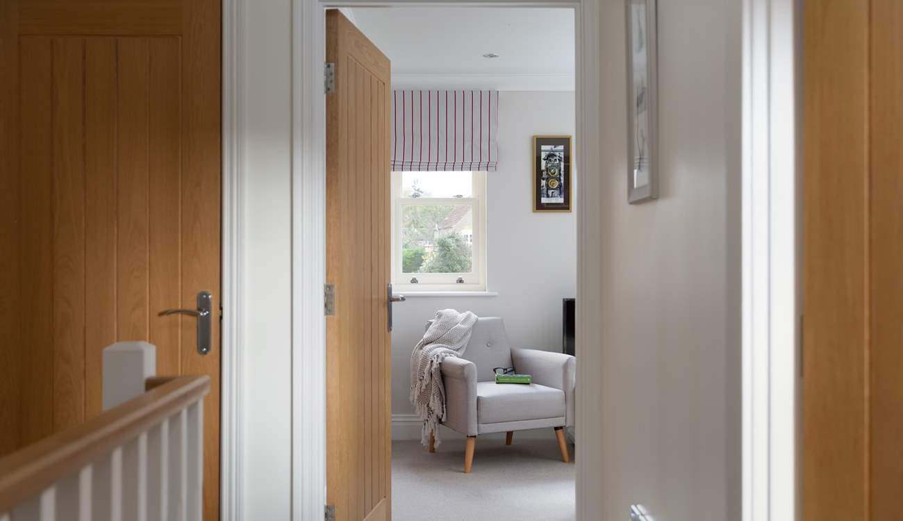 The hallway leads to the snug.