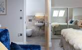 The Velux window's light is reflected in the mirrors making this a lovely bright bedroom. - Thumbnail Image