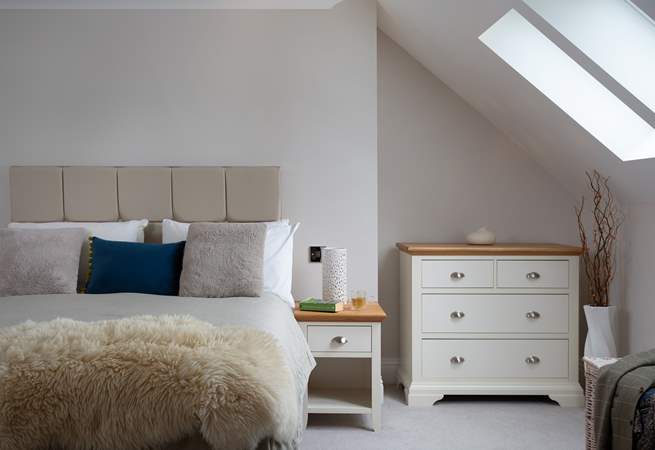 Sunlight streams in through the Velux window.