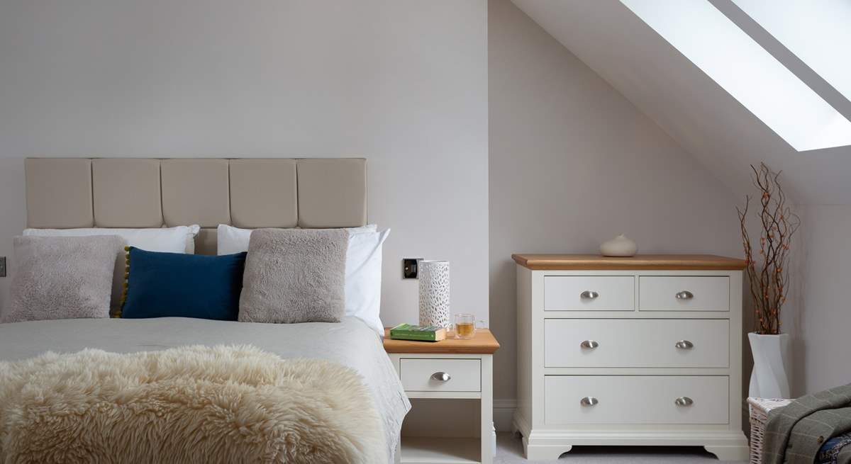 Sunlight streams in through the Velux window.