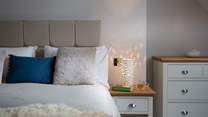 The bedside light gives off a dappled glow, perfect for bedtime. 