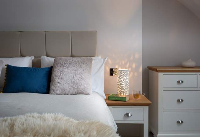The bedside light gives off a dappled glow, perfect for bedtime. 