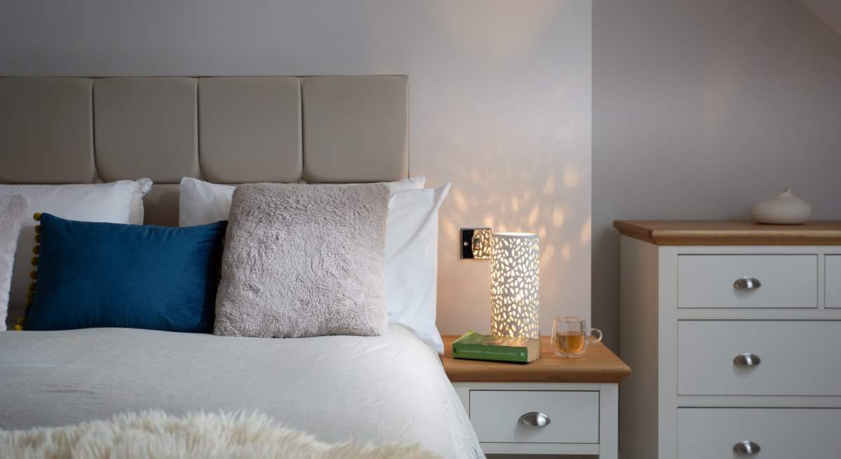 The bedside light gives off a dappled glow, perfect for bedtime. 