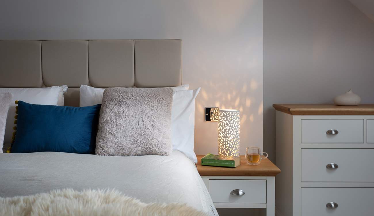 The bedside light gives off a dappled glow, perfect for bedtime. 