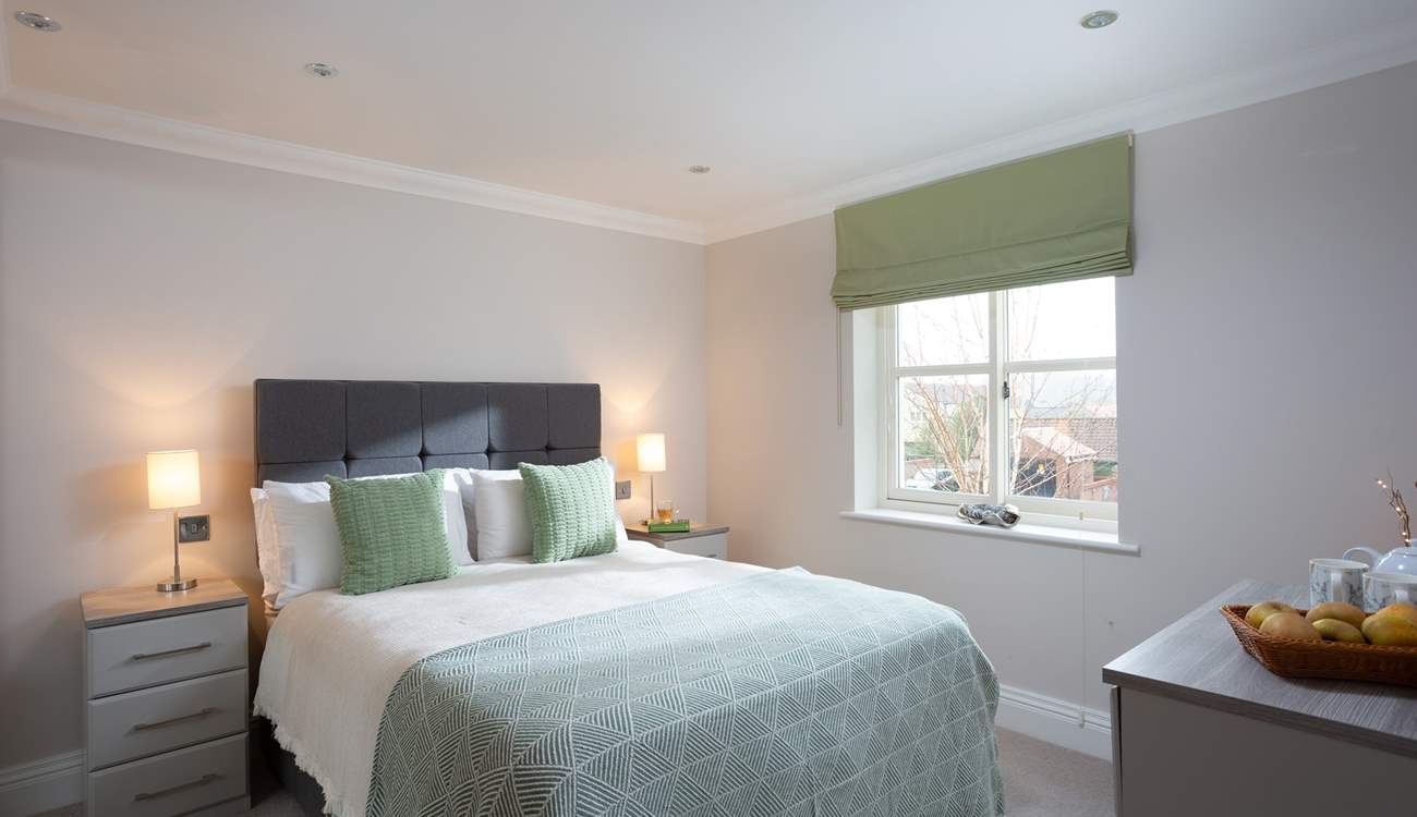 The double bedroom on the first floor is a relaxing space.