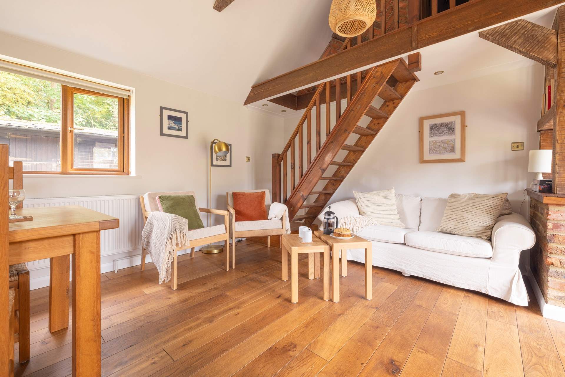 Unwind in this cosy living area, after a busy day exploring. Please note, the stairs lead to a locked storage area which is not available for guests' use.