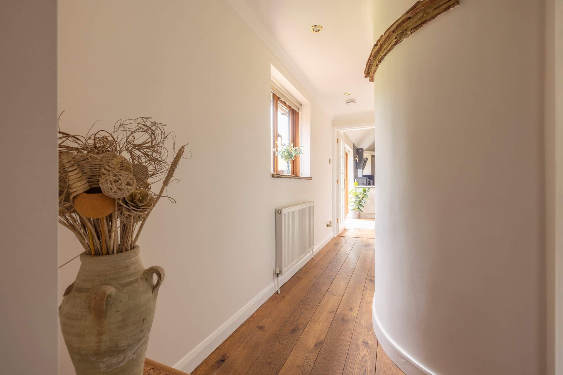 The hallway from the bedrooms and family bathroom lead to the open plan living area.
