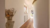 The hallway from the bedrooms and family bathroom lead to the open plan living area.
