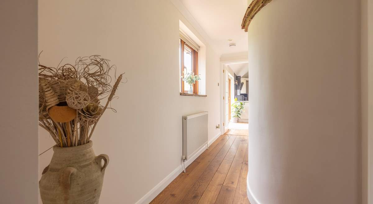 The hallway from the bedrooms and family bathroom lead to the open plan living area.
