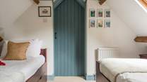 Head upstairs to the twin bedroom.