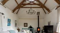 On those chillier days, light the wood-burner and snuggle down in front of the television. The door to bedroom 3 is down a few stairs from the sitting-room.