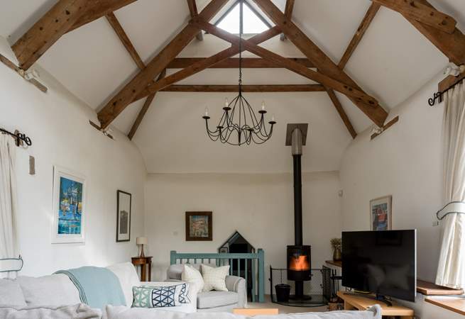 On those chillier days, light the wood-burner and snuggle down in front of the television. The door to bedroom 3 is down a few stairs from the sitting-room.