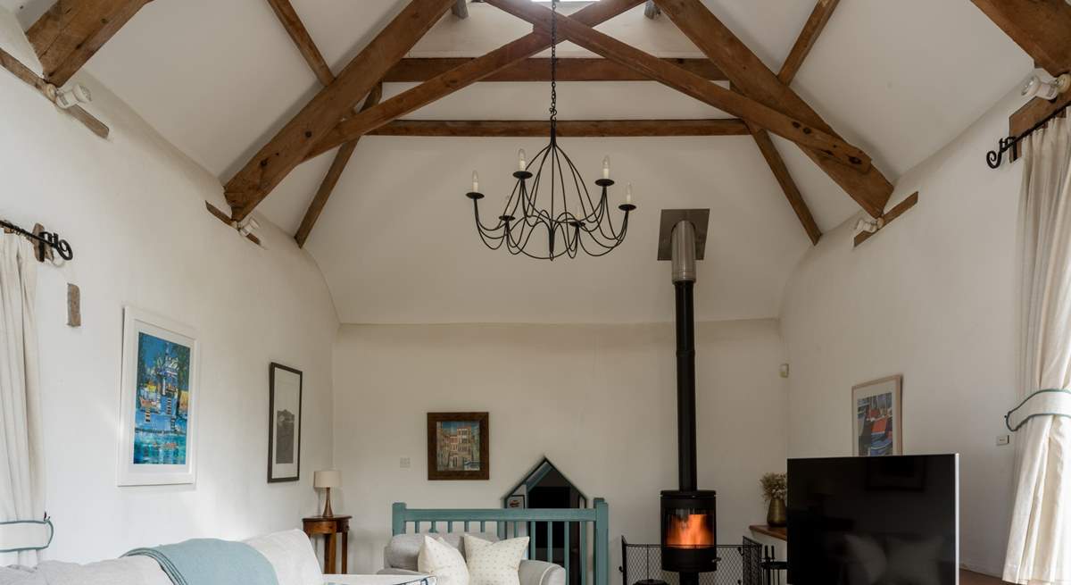 On those chillier days, light the wood-burner and snuggle down in front of the television. The door to bedroom 3 is down a few stairs from the sitting-room.