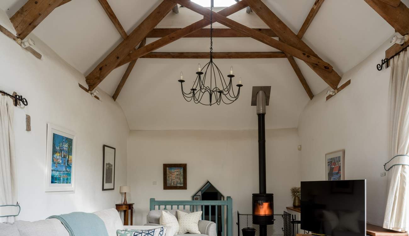 On those chillier days, light the wood-burner and snuggle down in front of the television. The door to bedroom 3 is down a few stairs from the sitting-room.