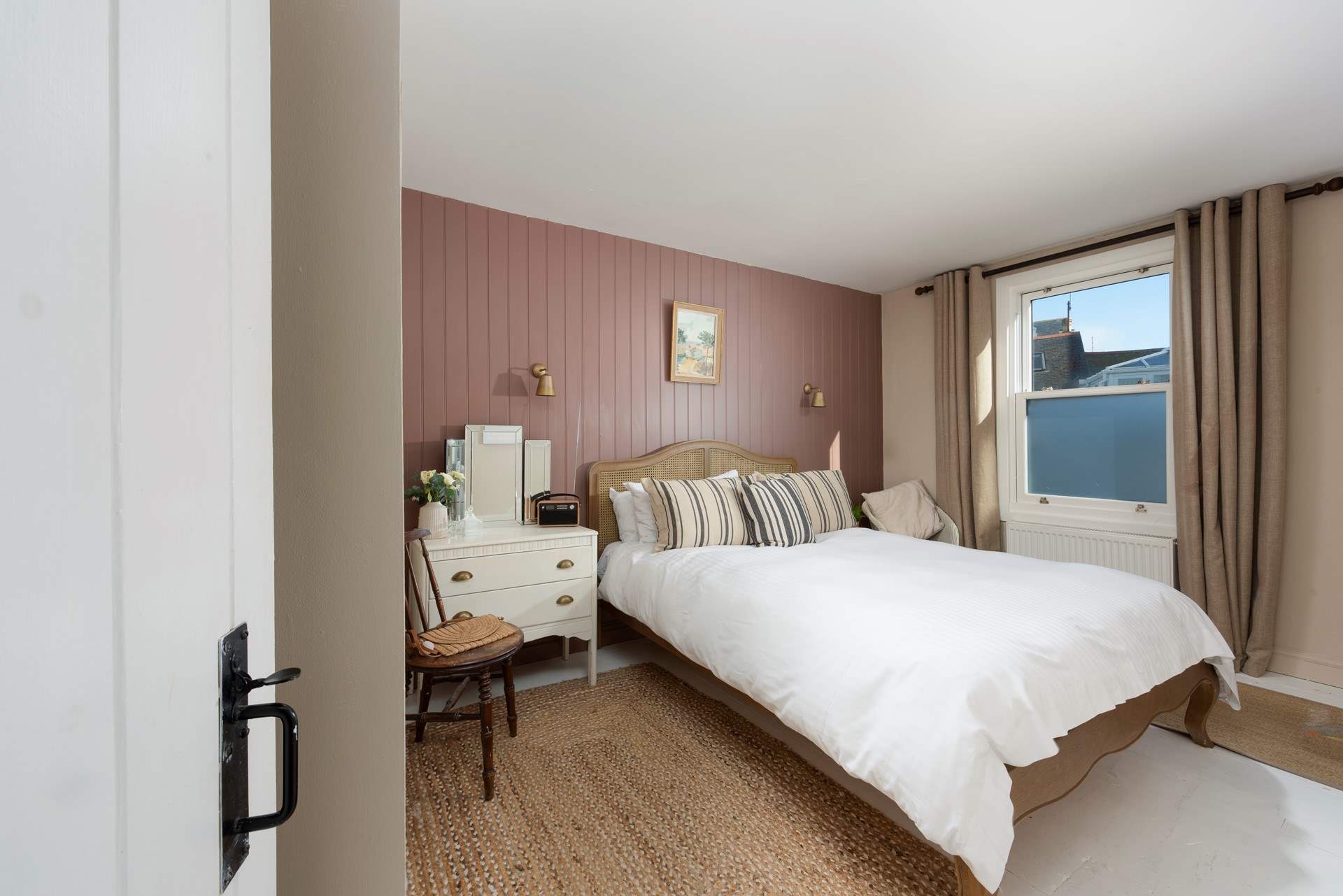 Drift off to sleep in this elegant king-size bed.