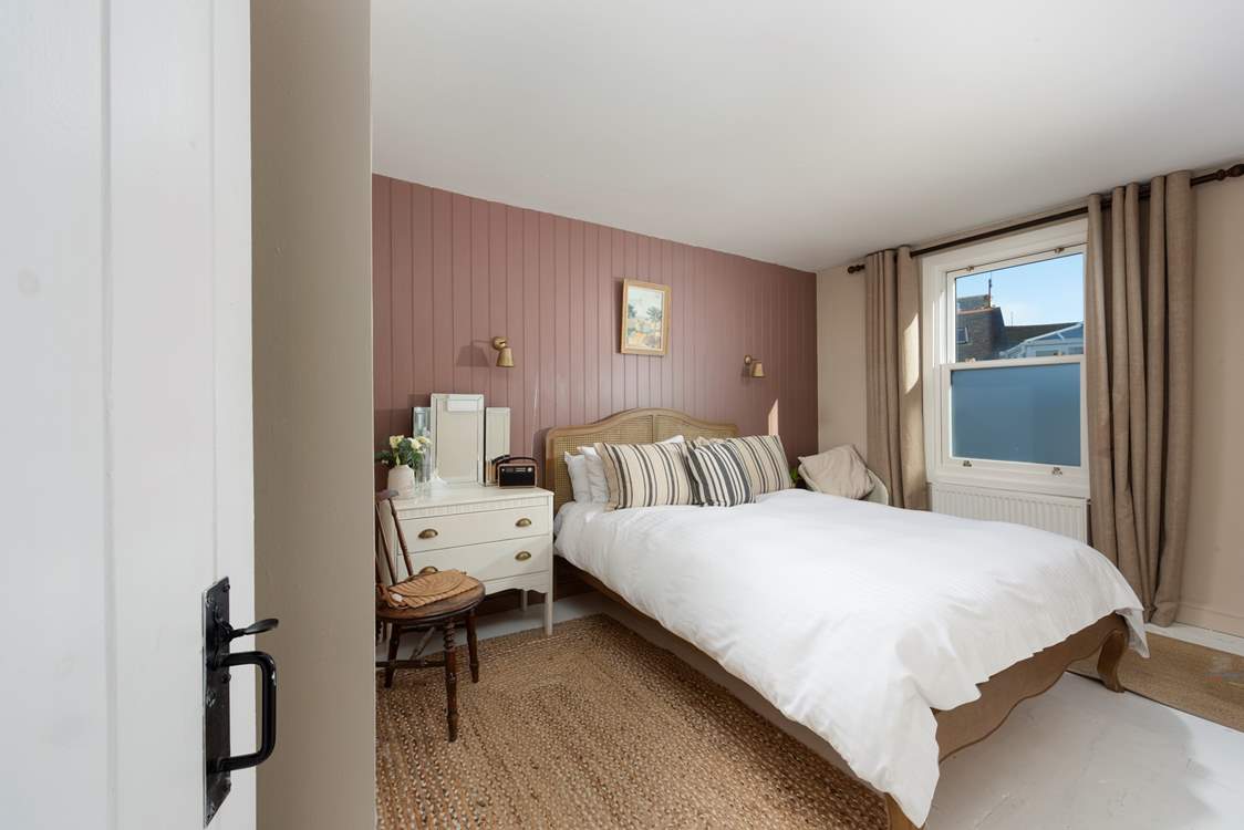 Drift off to sleep in this elegant king-size bed.