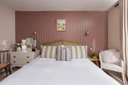 An elegantly styled bedroom designed for restful nights and lazy mornings.