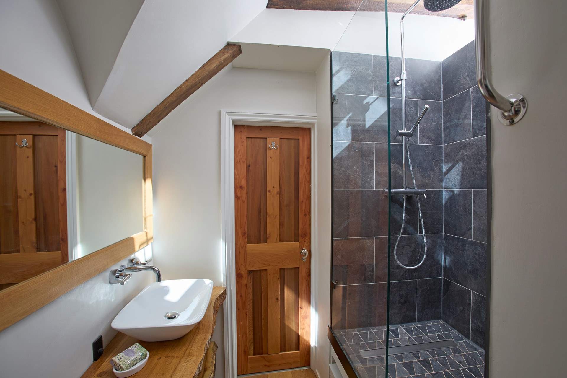 The shower-room, shared with bedrooms 3 and 4, is a light and bright quirky space.