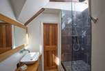The shared shower-room with its quirky step-up shower is en suite to bedrooms 2 and 3.